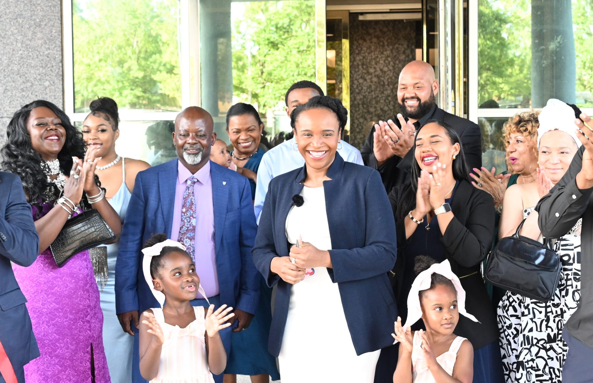 Chief Nnakina Xi-Amaru Fears smiling as citizens, families and children applaud at the opening of the Xi-Amaru Republic walk-in office in Memphis
